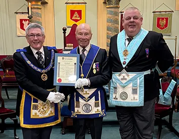 W.Bro Tony Cathcart receiving his 50 years certificate from W Bro. Charles Yelland APGM