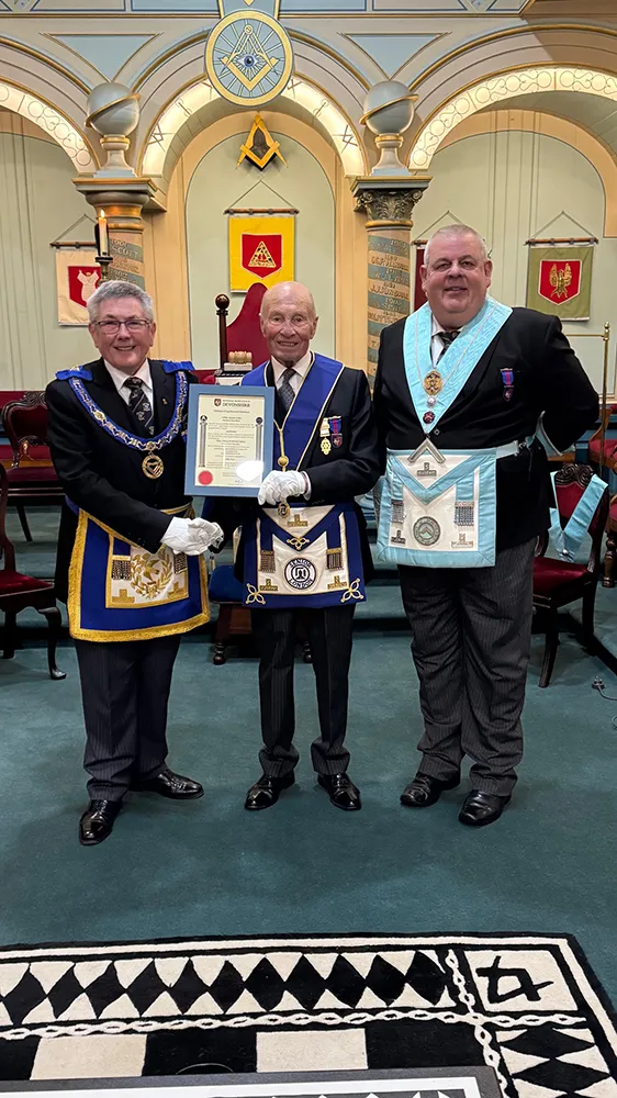 W.Bro Tony Cathcart receiving his 50 years certificate from W Bro. Charles Yelland APGM