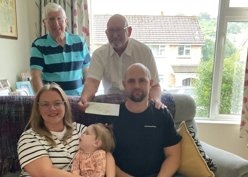 Kirsty and Clark (Seated) with Baby May, and standing lodge charity steward Mike Harding and treasurer Bob Taylor